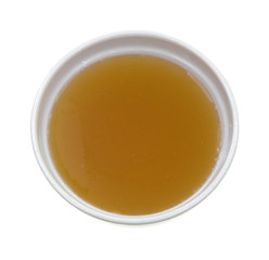 Chicken broth top view in bowl on a white background