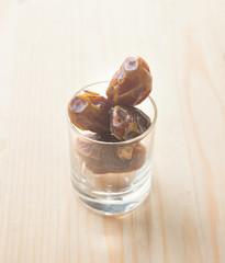 Date palm fruits or kurma, ramadan food  vintage retro effect.