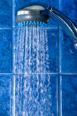 Naklejka na ściany i meble shower with water stream in a shower unit