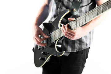 Fototapeta na wymiar Young man playing guitar over white background