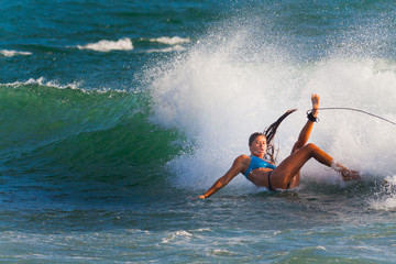 Surfer on Blue Ocean Wave in Bali - obrazy, fototapety, plakaty