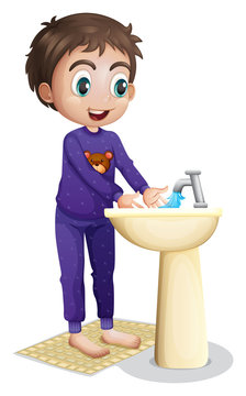 A boy washing his hands