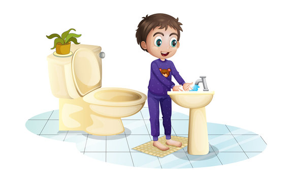 A boy washing his hands at the sink