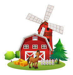 A smiling horse outside the red barnhouse with a windmill