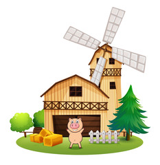 A playful pig outside the wooden barnhouse with a windmill