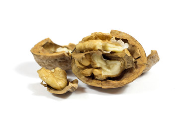 Closeup of a cracked walnut isolated on white background
