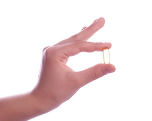 hand holding  pills on white background