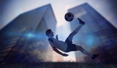 Fototapeta na wymiar Composite image of football player in white kicking