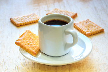 Coffee with Cookies on Wooden Table.