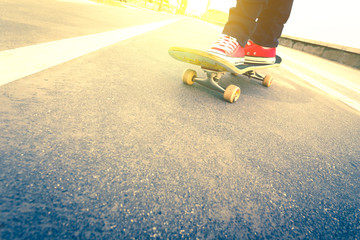 skateboarder trick in beach road