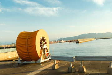 Yellow Oil Spill Boom Reel Nearby the Beach