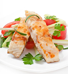 Fried filet fish and fresh vegetable salad
