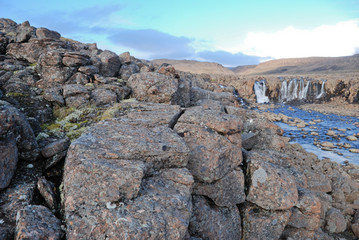 Fototapeta na wymiar Landscape with rocks and a waterfall.
