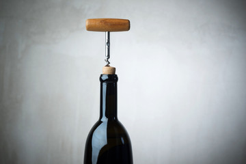 Bottle of wine with corkscrew © poplasen