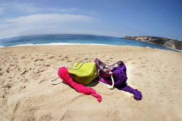 Vivid summer bags on the beach