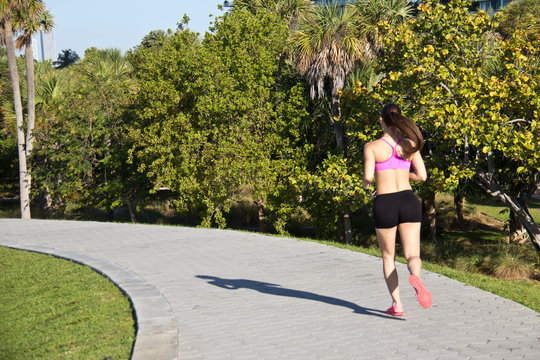 Girl jogging along a path