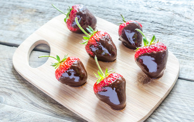 Fresh strawberries covered with dark chocolate