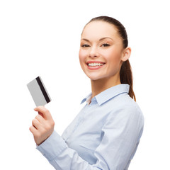 smiling businesswoman showing credit card