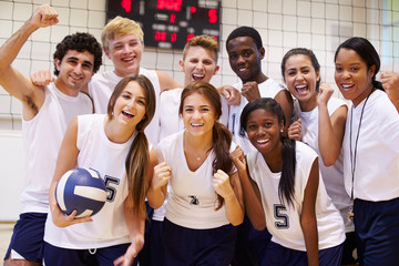 Portrait Of High School Volleyball Team Members With Coach - Powered by Adobe