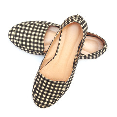 flat lady's shoes with checkered pattern on white background