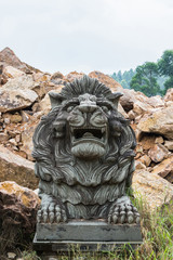 Fototapeta na wymiar Stone Lion Carving at the temple.