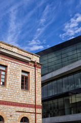 Aged building versus modern architecture, in Athens, Greece