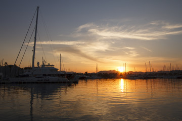 Fototapeta na wymiar Yachts in harbor at sunset