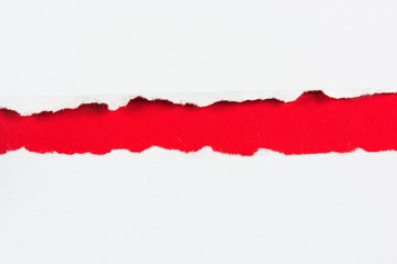 tear red paper pieces of paper on white