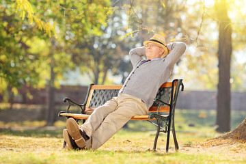 Senior man relaxing in park on a sunny day