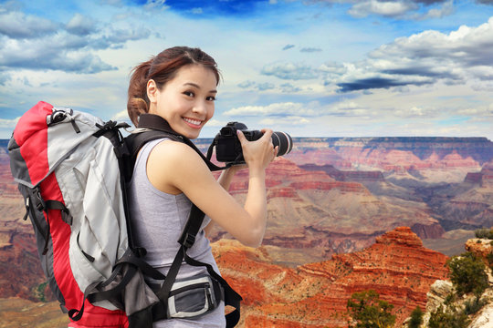 woman mountain hiker taking pictures