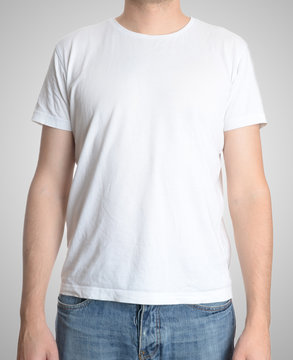Man wearing blank t-shirt isolated on gray