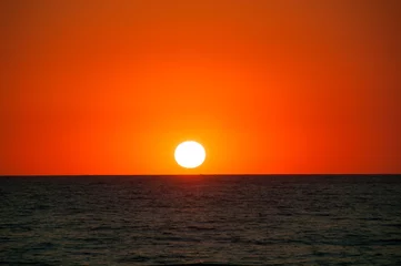 Door stickers Sea / sunset Orange Sunset on the sea horizon, skyline