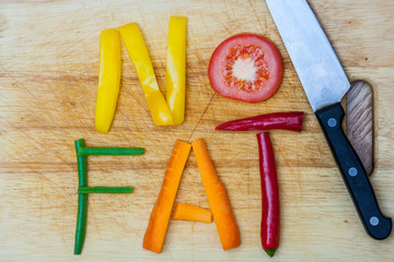 No fat, word written with letters formed from vegetables