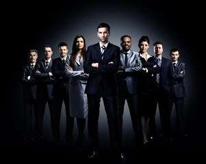 business team standing over a dark background