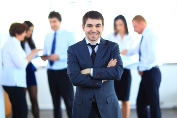 Smiling businessman in his office
