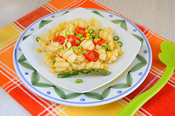 lumaconi pasta by tomatoes sliced