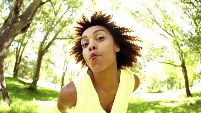 Afro Girl with pulling faces in park