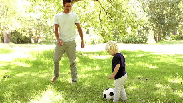 Father and Son playing soccer