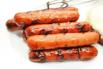 Hotdogs Cooked on a Grill for a Summer Picnic