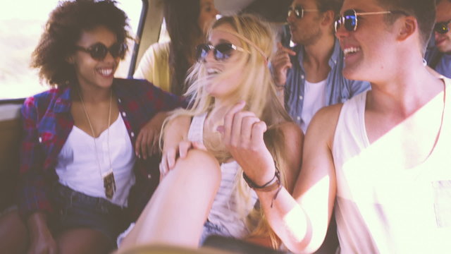 Laughing friends on a road trip
