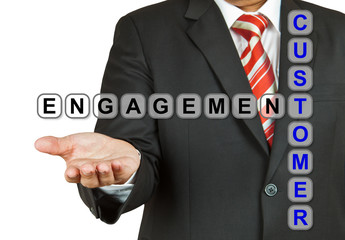 Businessman with wording Customer Engagement isolated on white b