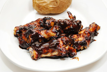 Barbequed Chicken Wing Pieces Served on a Plate