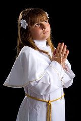 Brunette young girl praying for first communion