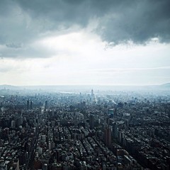 Aerial view of Taipei, Taiwan under dark clouds.