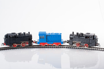 three toy locomotives
