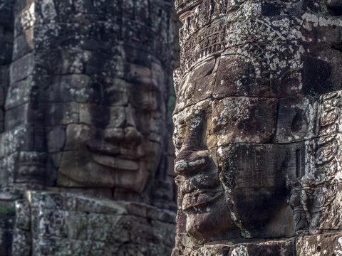 Giant Stone Faces at Bayon Temple at Angkor, Cambodia