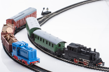two toy trains and coins