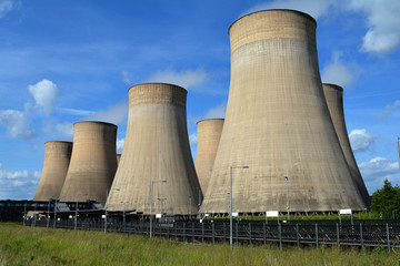 Coal fired power station cooling towers against summer sky