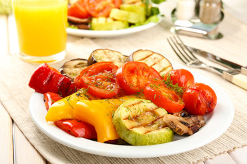 Delicious grilled vegetables on plate on table close-up