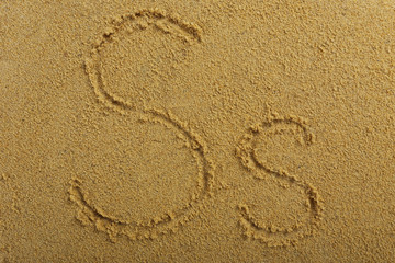 Alphabet letter written on wet beach sand